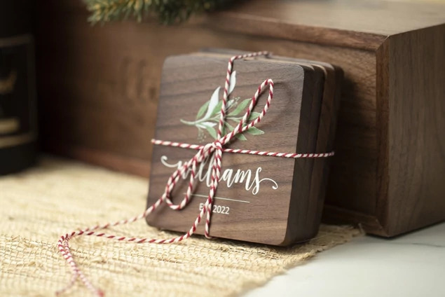 Set of four rounded edge Walnut Tyndell Wood Coasters with full color printing.