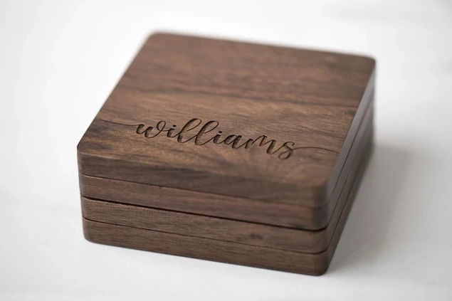 Set of four rounded edge Walnut Tyndell Wood Coasters  with logo engraving.